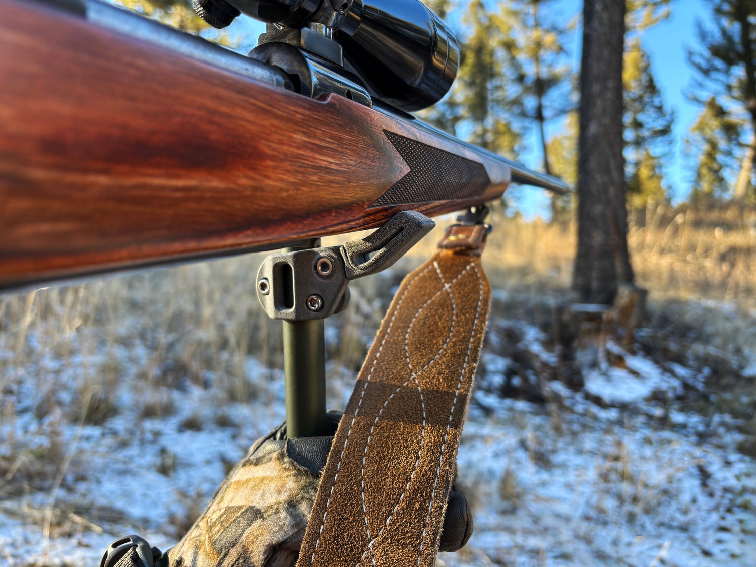 The roadrunner rifle rest attached to a trekking pole to stabilize a rifle.