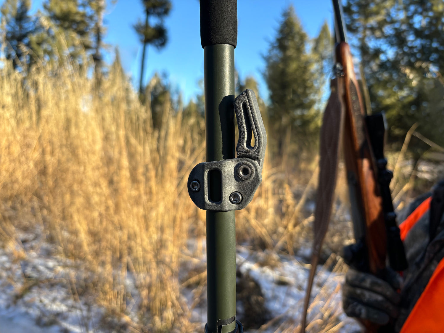 The roadrunner rifle rest in its stowed position attached to a trekking pole.